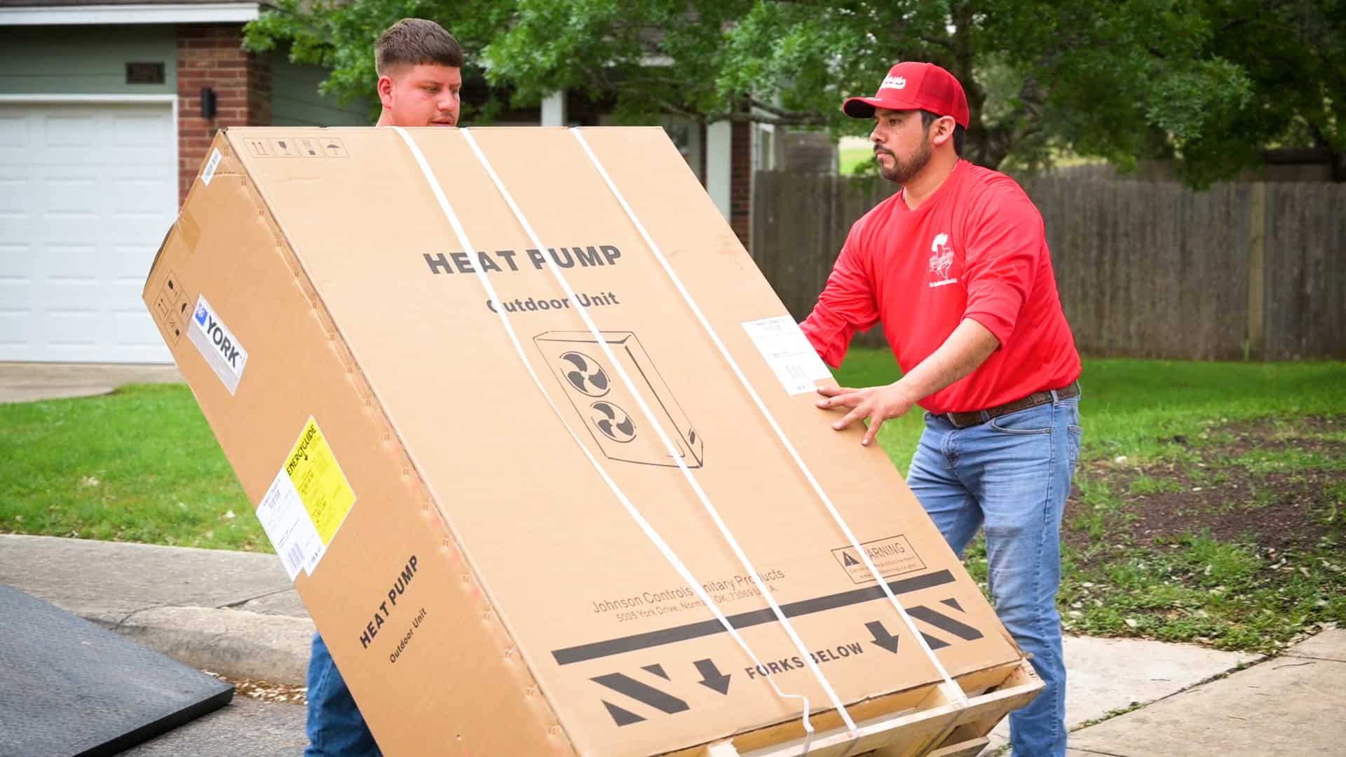 Crew installing new heat pump